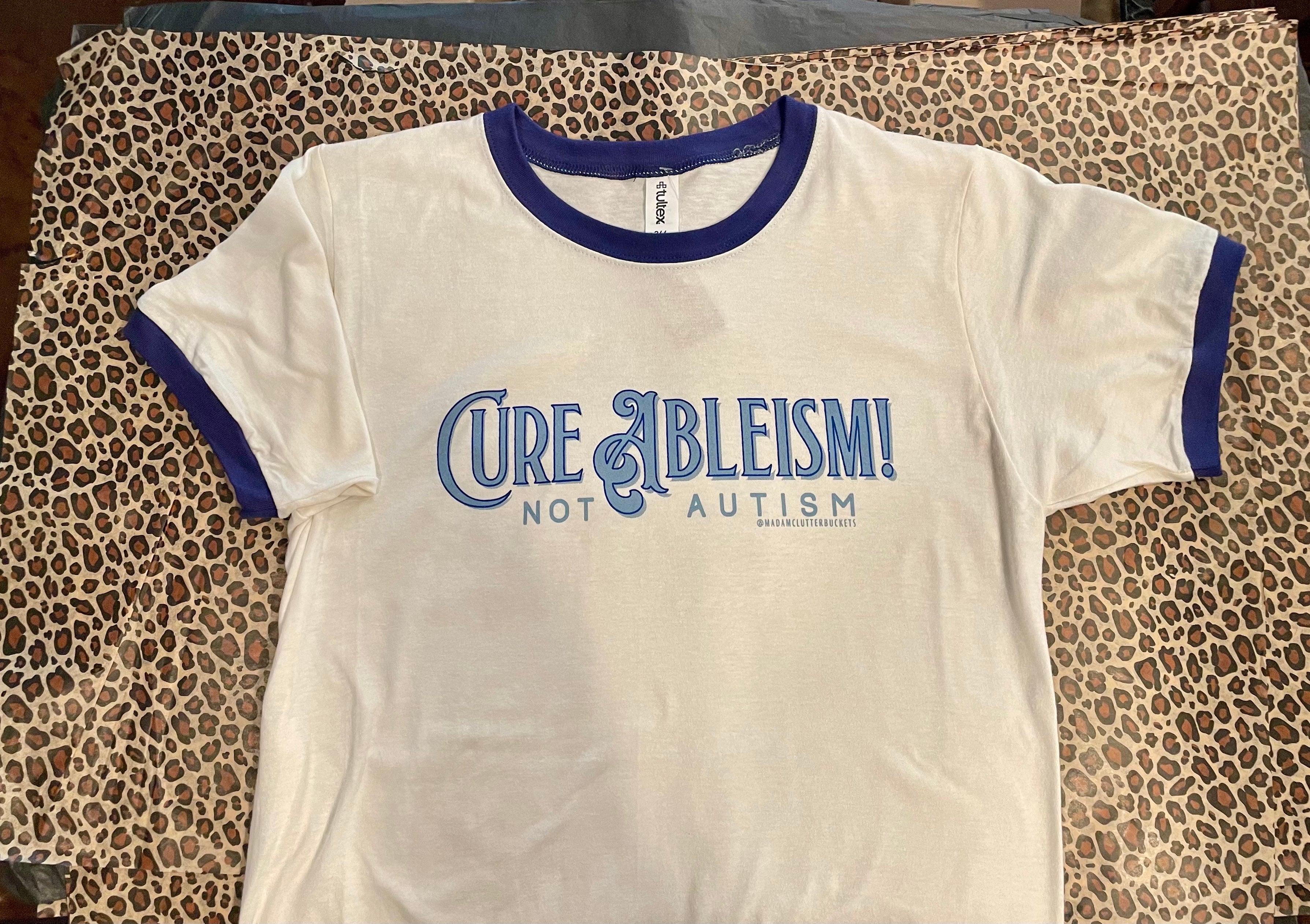 Cure Ableism, Not Autism Ringer T-Shirt by Madam Clutterbucket's!