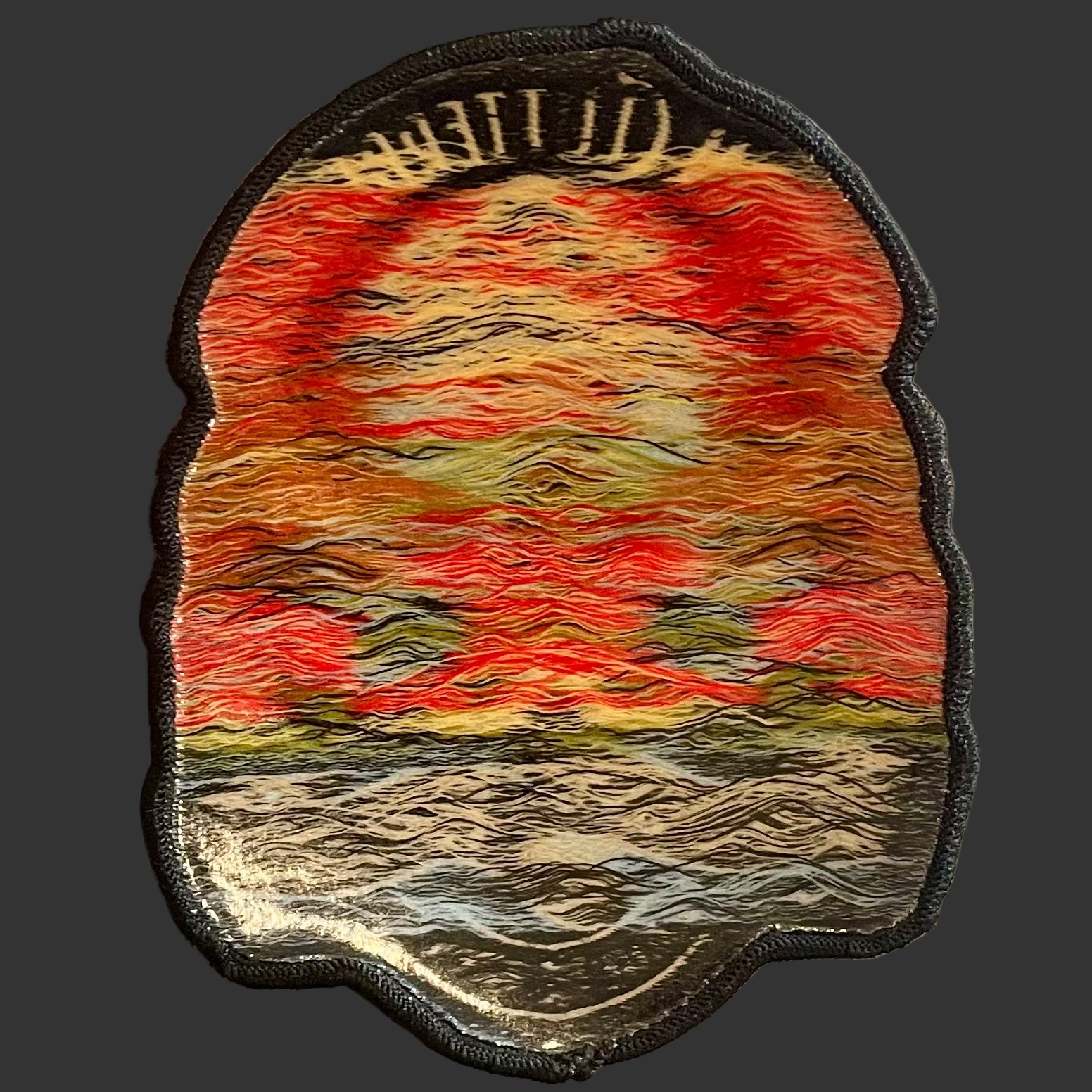 A view of the back of the patch. It has an iron on background